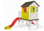 House on stilts with a slide